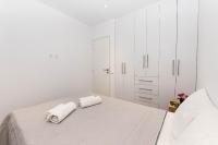 Łóżko lub łóżka w pokoju w obiekcie Anius Apartments