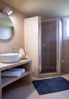 a bathroom with a sink and a shower at Voulamandis House in Kambos