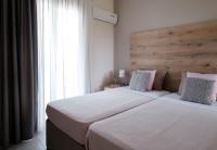 Postel nebo postele na pokoji v ubytování Megali Beach Nikos