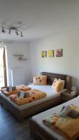 A bed or beds in a room at Penzión Zunama