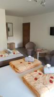 A bed or beds in a room at Penzión Zunama