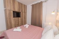 Łóżko lub łóżka w pokoju w obiekcie Anius Apartments