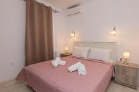 Łóżko lub łóżka w pokoju w obiekcie Anius Apartments