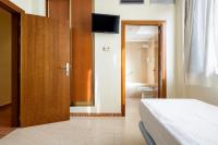 A bed or beds in a room at Hospedium Hotel Don Fidel