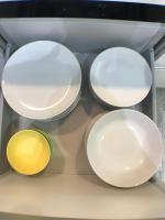 four plates on a shelf in a refrigerator at Apartmento Apartaclub La Barrosa 223 in Chiclana de la Frontera