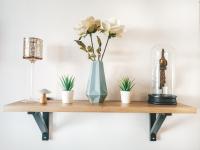 a wooden shelf with a vase of flowers on it at La Loggia - Appartement Terrasse + Garage à Grenoble in Grenoble