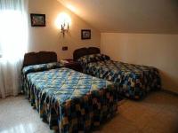 Postel nebo postele na pokoji v ubytování Hotel Los Nogales