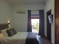 Posteľ alebo postele v izbe v ubytovaní Hostal Cuzco