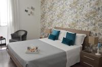 Posteľ alebo postele v izbe v ubytovaní Nobilcasa Suites