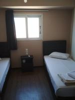 Postel nebo postele na pokoji v ubytování Pella Inn Hostel