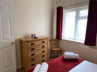 Postel nebo postele na pokoji v ubytování Byways Serviced Apartments