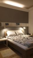 Posteľ alebo postele v izbe v ubytovaní Apartmani N.May's