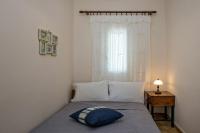 A bed or beds in a room at Xατζηράδος