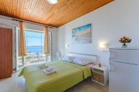 Posteľ alebo postele v izbe v ubytovaní Rooms Sani