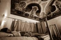 A bed or beds in a room at Ostello degli Elefanti