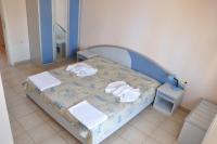 Postel nebo postele na pokoji v ubytování Hotel BelleVille