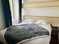 Katil atau katil-katil dalam bilik di H&ocirc;tel-Restaurant La Bergerie
