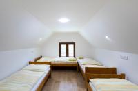 Postel nebo postele na pokoji v ubytování Hotel Rusava chaty