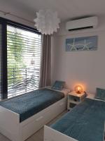 Posteľ alebo postele v izbe v ubytovaní Aprum Apartments 12C