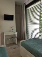 Televízia a/alebo spoločenská miestnosť v ubytovaní Aprum Apartments 12C