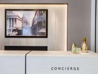 a counter top with a picture on a wall at Hotel Royal Saint Honore Paris Louvre in Paris