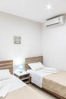 Postel nebo postele na pokoji v ubytování Fantasia Villas Deluxe "Selene"