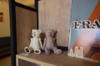 two teddy bears sitting on top of a shelf at Bonjour, Paris in Taitung City