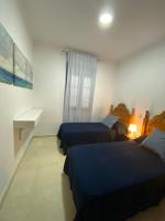 Postel nebo postele na pokoji v ubytování SWEET HOME AYAMONTE