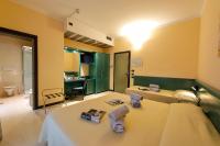 Posteľ alebo postele v izbe v ubytovaní Hotel Eden