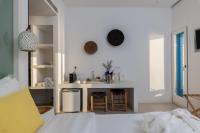 Posteľ alebo postele v izbe v ubytovaní Bluetopia Suites