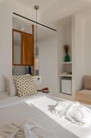 Posteľ alebo postele v izbe v ubytovaní Bluetopia Suites