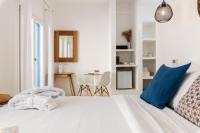 Posteľ alebo postele v izbe v ubytovaní Bluetopia Suites