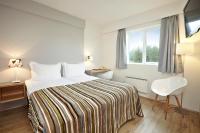 Postel nebo postele na pokoji v ubytování Hotel Klaustur