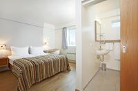 Postel nebo postele na pokoji v ubytování Hotel Klaustur