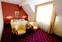 Łóżko lub łóżka w pokoju w obiekcie Hotel Tilia