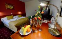 Łóżko lub łóżka w pokoju w obiekcie Hotel Tilia