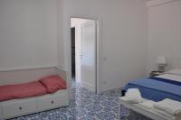A bed or beds in a room at Calise guest house B senza balcone