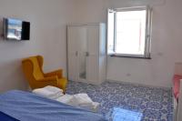 A bed or beds in a room at Calise guest house B senza balcone