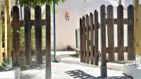 a wooden fence in front of a building at Casa Cueva “La Estrella” in Granada