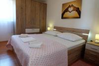 Łóżko lub łóżka w pokoju w obiekcie Holiday Home Tuta