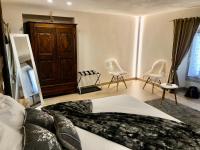 Posteľ alebo postele v izbe v ubytovaní Domus Apartments