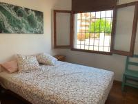 A bed or beds in a room at BADIA BEACH- Empuriabrava