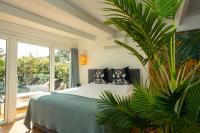 A bed or beds in a room at Caballito de Mar Boutique Hotel