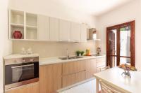 A kitchen or kitchenette at DomoMea - La Casa di Anna