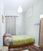 A bed or beds in a room at Iro - Kostas House 1