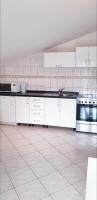 Kuchyň nebo kuchyňský kout v ubytování Apartment Antonio
