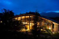 a building with a lot of windows at night at Hakone Retreat Före in Hakone