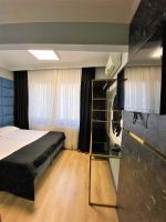 Postel nebo postele na pokoji v ubytování Orange Airport Hotel