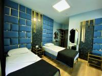 Postel nebo postele na pokoji v ubytování Orange Airport Hotel