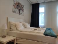 Posteľ alebo postele v izbe v ubytovaní 1210Apartment